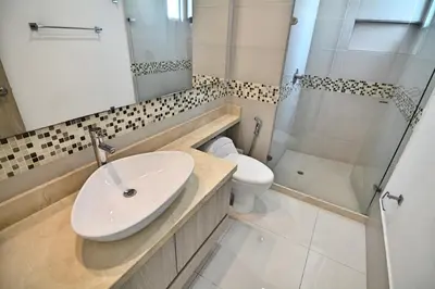 a bathroom with a sink and a toilet and a shower at Toscana Suite 2205 in Cartagena de Indias