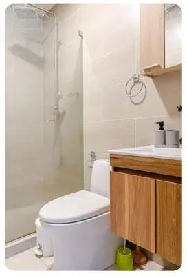 a bathroom with a white toilet and a shower at Casa Bacoba in Santa Marta