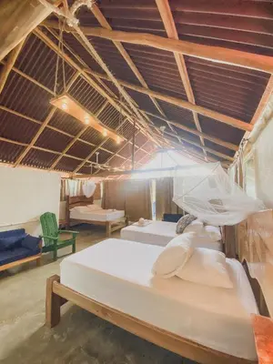 a large room with two beds and a couch at Mamallena Beachside Rincon del Mar in Rincón