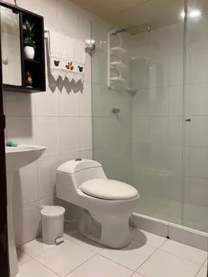 a bathroom with a toilet and a glass shower at Casa Encanto Cartagena Colombia in Cartagena de Indias
