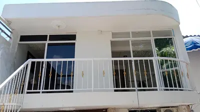 a white front porch of a house at Apartamento Excelente Ubicación Cartagena - Nuevo Bosque - Seguridad in Cartagena de Indias