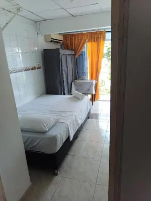a small bed in a room with a window at Apartamento Excelente Ubicación Cartagena - Nuevo Bosque - Seguridad in Cartagena de Indias