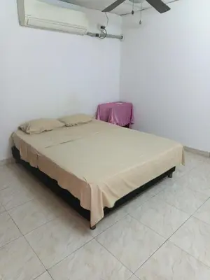 a bedroom with a bed in a white room at Apartamento Excelente Ubicación Cartagena - Nuevo Bosque - Seguridad in Cartagena de Indias