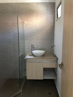 a bathroom with a sink and a shower at BUENAVISTA PLAZA APARTA HOTEL in Barranquilla