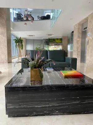 a living room with a couch and a table at BUENAVISTA PLAZA APARTA HOTEL in Barranquilla