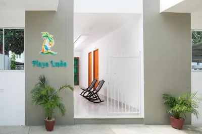 a lobby with two chairs and a sign that reads play turtle at Apartaestudio Playa Linda 101 in Coveñas