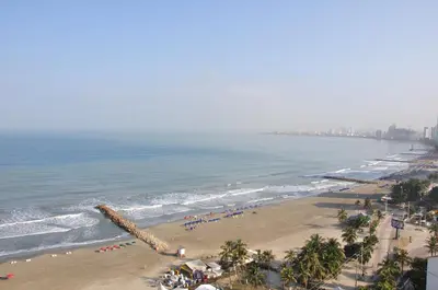 an aerial view of a beach with people and the ocean at I-Nice 1 Bedroom Apt Laguito in Cartagena de Indias