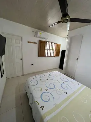 a bedroom with a large bed in a room at Casa 39-33 in Cartagena de Indias