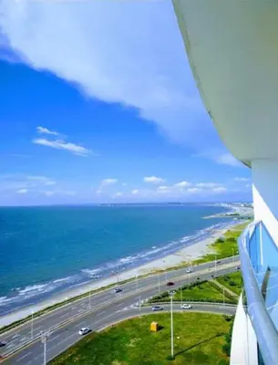 a view of a road and the ocean from a building at Pent House 450 mts 360 front ocean view playa azul in Cartagena de Indias