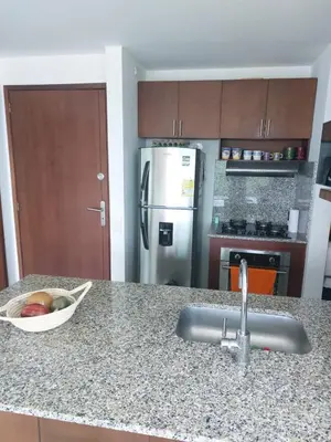 a kitchen counter with a sink and a bowl of fruit at Apartamento Morros vitri 214 zona norte in Cartagena de Indias