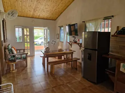 a kitchen with a refrigerator and a table in it at El ensueño in San Bernardo del Viento