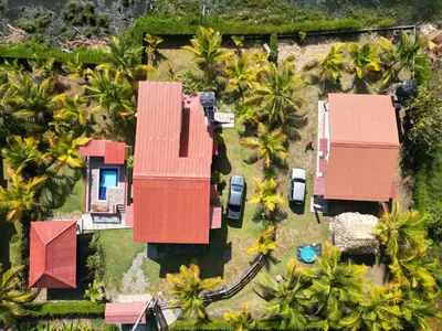 an aerial view of a house with palm trees at El ensueño in San Bernardo del Viento