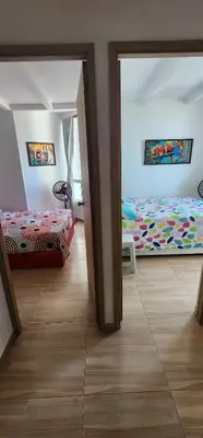 a room with two beds in a room at Hermoso apartamento, Cartagena, amoblado, cómodo. in Cartagena de Indias