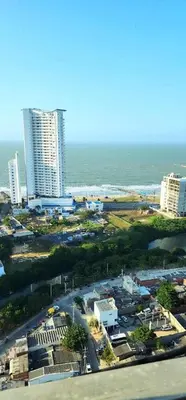 an aerial view of a city with the ocean and buildings at Hermoso apartamento, Cartagena, amoblado, cómodo. in Cartagena de Indias