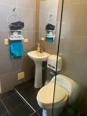 a bathroom with a toilet and a sink at Ubicación increíble! cerca del centro y del mar in Cartagena de Indias