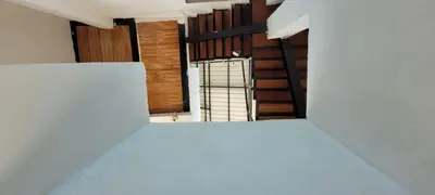 a view from the top of a white room with a stairway at Cabaña El Faro in Tubará