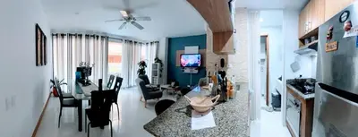 a living room with a kitchen and a dining room at Edificio con piscina frente al mar con Excelente ubicación piso 4 in Cartagena de Indias