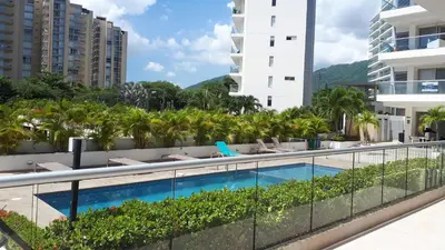 a swimming pool on the balcony of a building at Santa Marta Apartamento en Bello Horizonte in Santa Marta