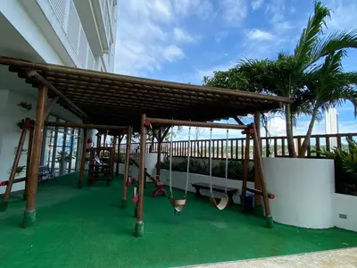 a wooden pergola on a balcony with a swing at Paraíso frente al Mar Caribe en Cartagena. in Cartagena de Indias