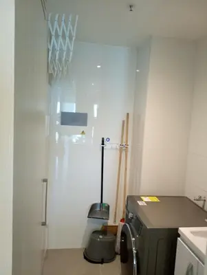 a small kitchen with a sink and a stove at Linda suite in Barranquilla