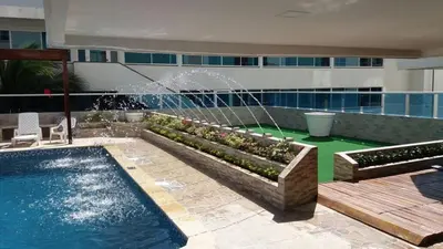 a pool with a fountain in the middle of a building at Apartamento en Cartagena Colombia in Cartagena de Indias