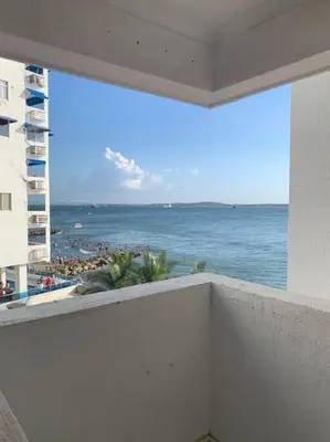 a view of the ocean from the balcony of a building at Apartamento en el Laguito - Cartagena cerca al mar in Cartagena de Indias