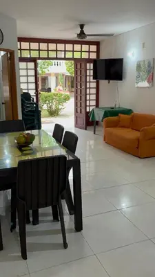 a living room with a table and a couch at Cabaña en coveñas in Coveñas