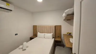 a small room with a bed in a room at Oceanfront loft in high level neighborhood in Cartagena de Indias