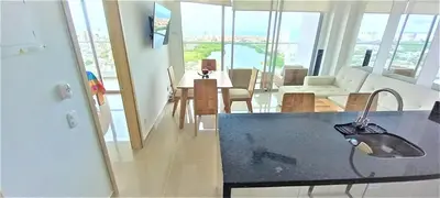 a kitchen and living room with a view of a house at P23 Brand New high floor, few blocks to walled city steps to beach in Cartagena de Indias