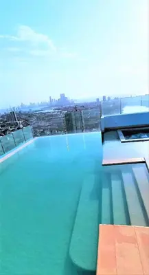a large pool of blue water on top of a building at P23 Brand New high floor, few blocks to walled city steps to beach in Cartagena de Indias