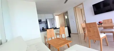 a kitchen and dining room with a table and chairs at P23 Brand New high floor, few blocks to walled city steps to beach in Cartagena de Indias