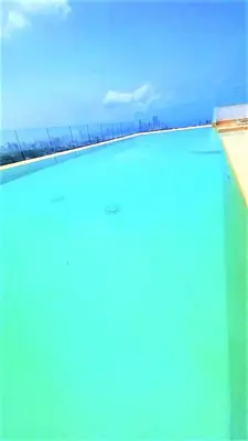 a pool of water with a view of the horizon at P23 Brand New high floor, few blocks to walled city steps to beach in Cartagena de Indias