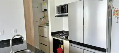 a kitchen with a stainless steel refrigerator and a stove at P23 Brand New high floor, few blocks to walled city steps to beach in Cartagena de Indias