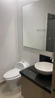 a bathroom with a white toilet and a sink at Edificio NUEVO DE LUJO CARTAGENA BOCAGRANDE in Cartagena de Indias