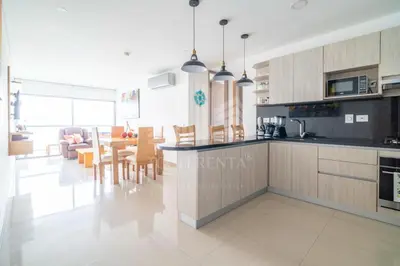 a kitchen and living room with a table and chairs at Edificio NUEVO DE LUJO CARTAGENA BOCAGRANDE in Cartagena de Indias