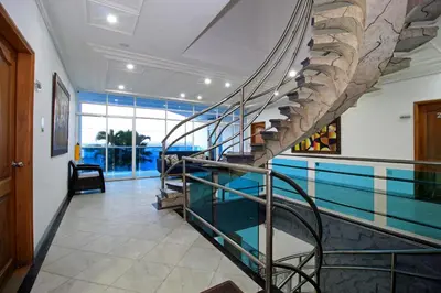 a swimming pool with a spiral staircase in a house at Hotel Abi Inn By GEH Suites in Cartagena de Indias