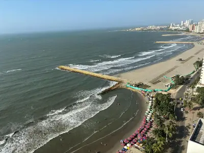 an aerial view of a beach with a crowd of people at APARTAMENTO PALMETTO ELIPTIC Bocagrande in Cartagena de Indias