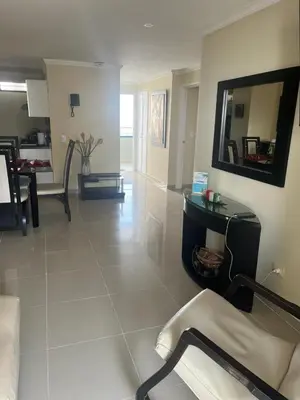 a living room with a mirror on the wall at Lindo Apartamento cerca al mar in Cartagena de Indias