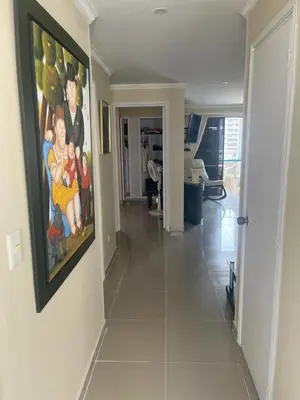 a hallway of a home with a painting on the wall at Lindo Apartamento cerca al mar in Cartagena de Indias