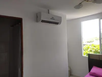 a room with a white air conditioner on the wall at DULCE HOGAR in Cartagena de Indias