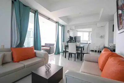 a living room with a couch and a table at Apartamento Bocagrande Vista al Mar Piso 31 in Cartagena de Indias