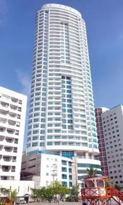 a large tall building in the middle of a city at Apartamento Bocagrande Vista al Mar Piso 31 in Cartagena de Indias