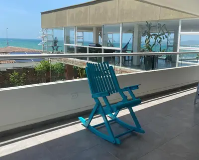 a blue chair sitting on top of a building at Villa frente al Mar cerca a Barranquilla in Tubará