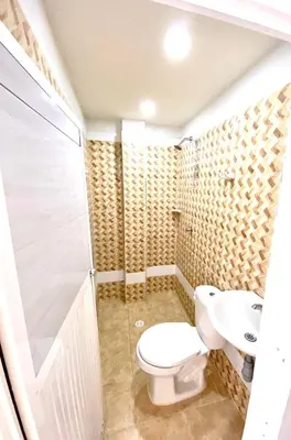 a bathroom with a toilet and a sink at Apartamentos Rincón Garcia in Cartagena de Indias