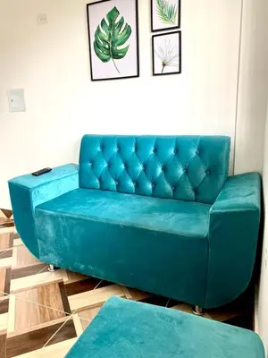 a blue couch sitting in a living room at Apartamentos Rincón Garcia in Cartagena de Indias