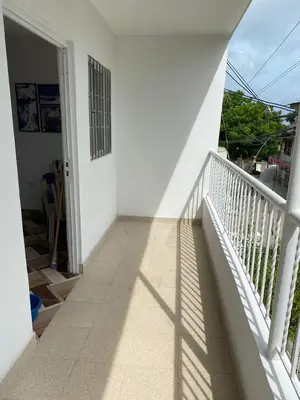 a balcony of a house with a view of the street at Apartamentos Rincón Garcia in Cartagena de Indias