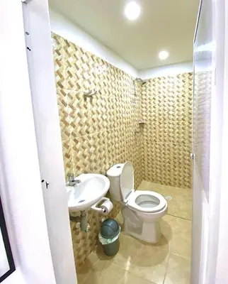 a bathroom with a toilet and a sink at Apartamentos Rincón Garcia in Cartagena de Indias