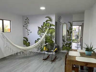 a room with plants on the wall and a mirror at Apartamento Cómodo y encantador en cartagena in Cartagena de Indias