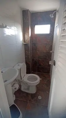 a bathroom with a toilet and a sink at Apartamento Cómodo y encantador en cartagena in Cartagena de Indias