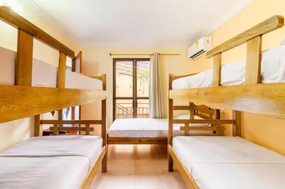 two bunk beds in a room with a window at Hostal Cartagonova - Habitaciones privadas y amplias cerca a zonas turísticas in Cartagena de Indias